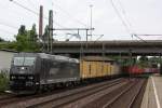 MRCE 185 545 am 31.7.12 mit einem Containerzug in Hamburg-Harburg.